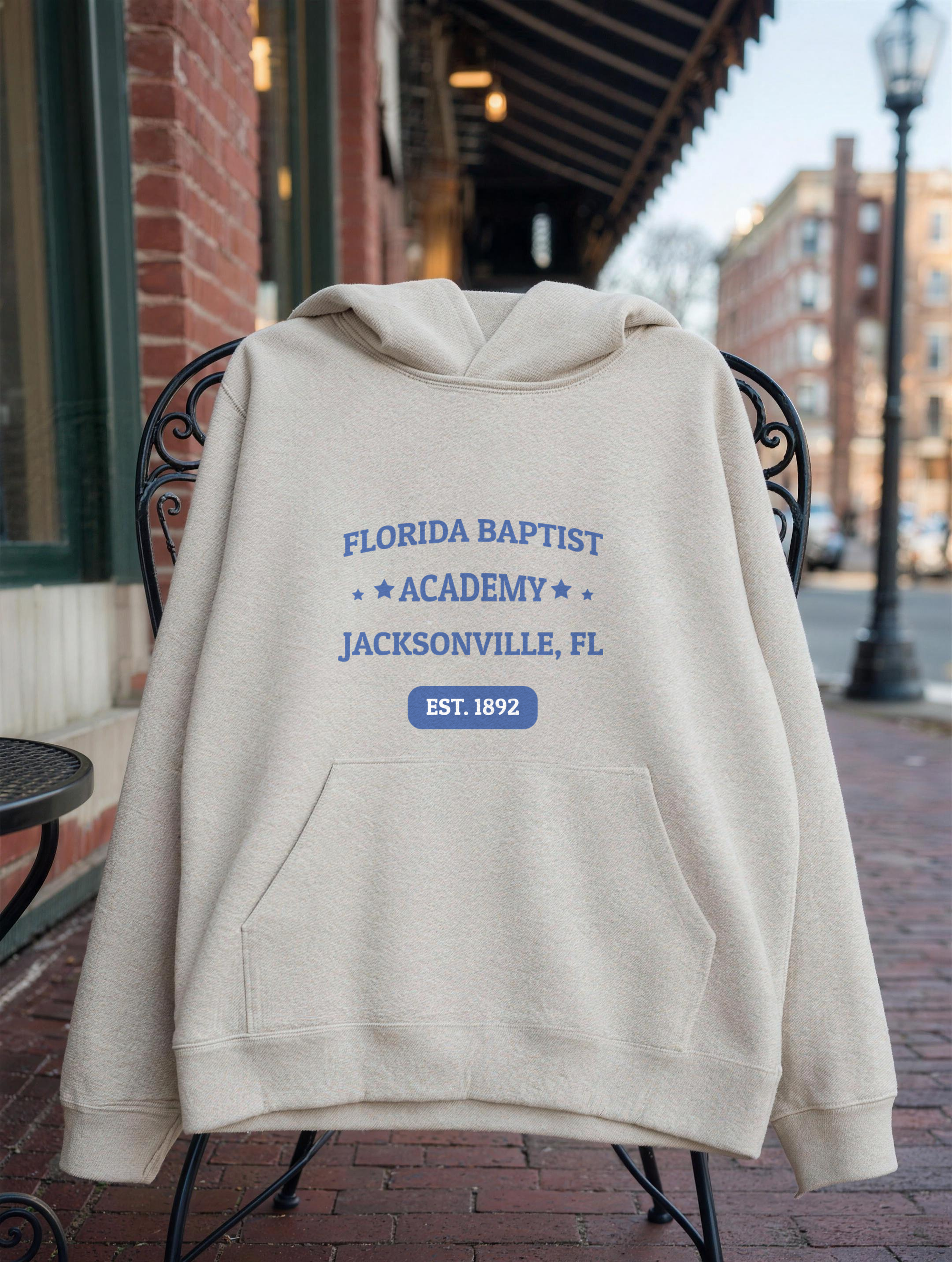 Unisex Hoodie in Oatmeal Heather with the Florida Baptist Academy 1892 heritage lockup — front view
