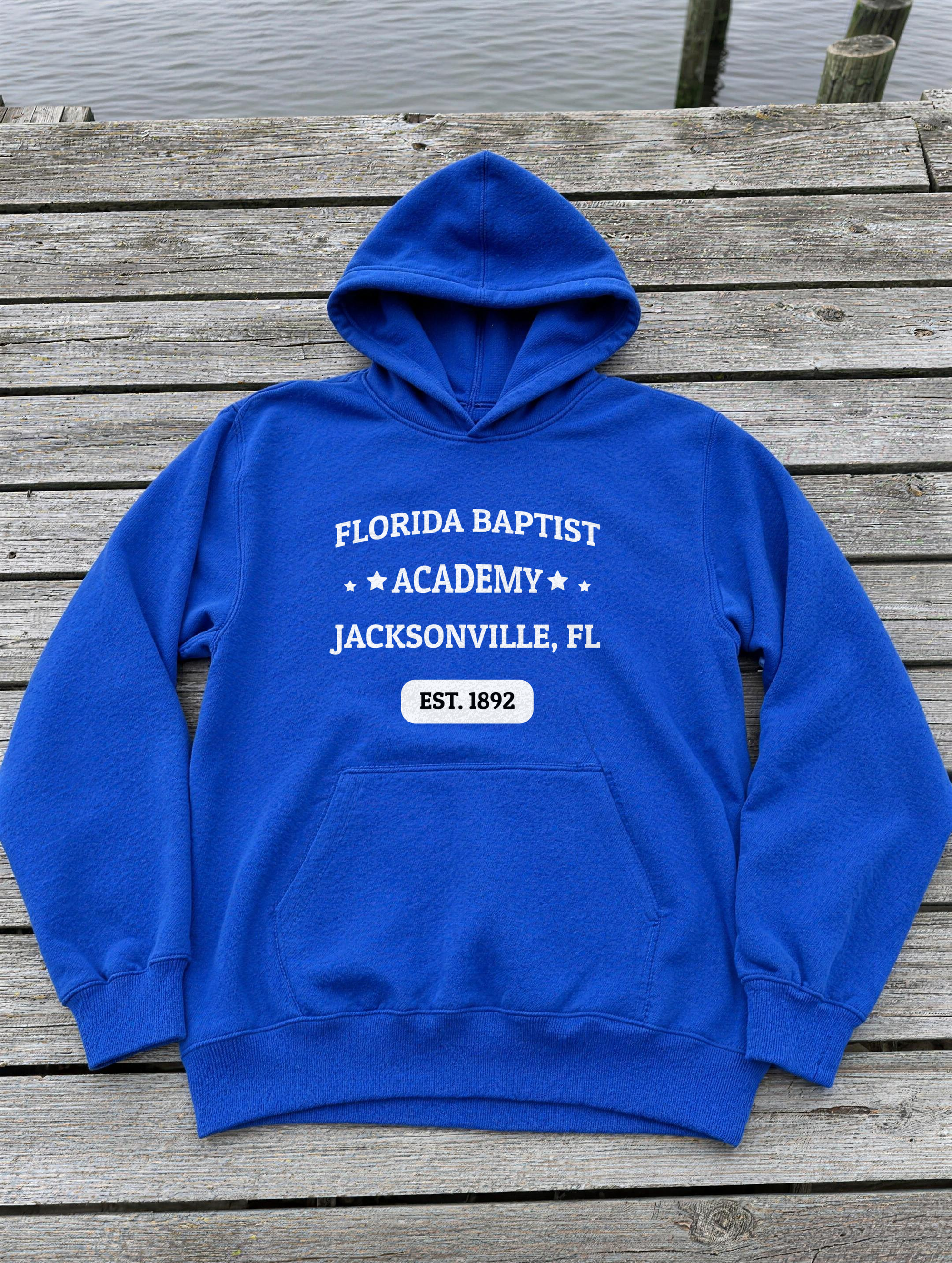 Unisex Hoodie in Team Royal with the Florida Baptist Academy 1892 heritage lockup — front view