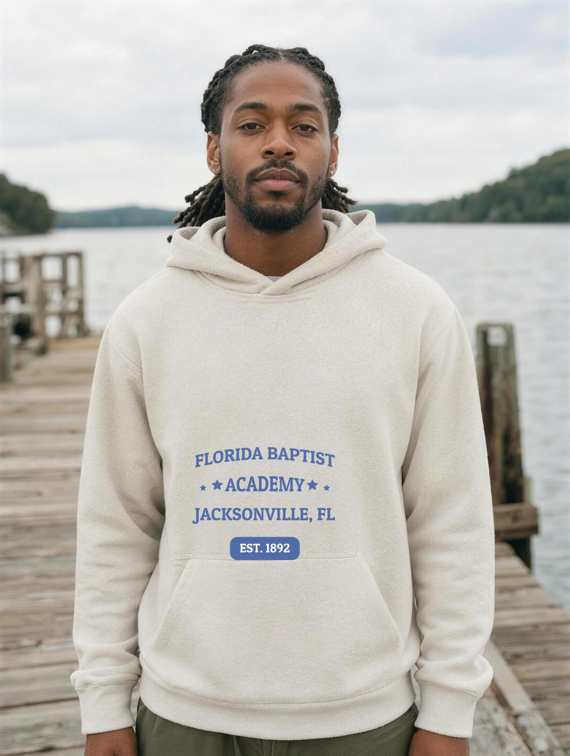 Unisex Hoodie in Oatmeal Heather with the Florida Baptist Academy 1892 heritage lockup — worn
