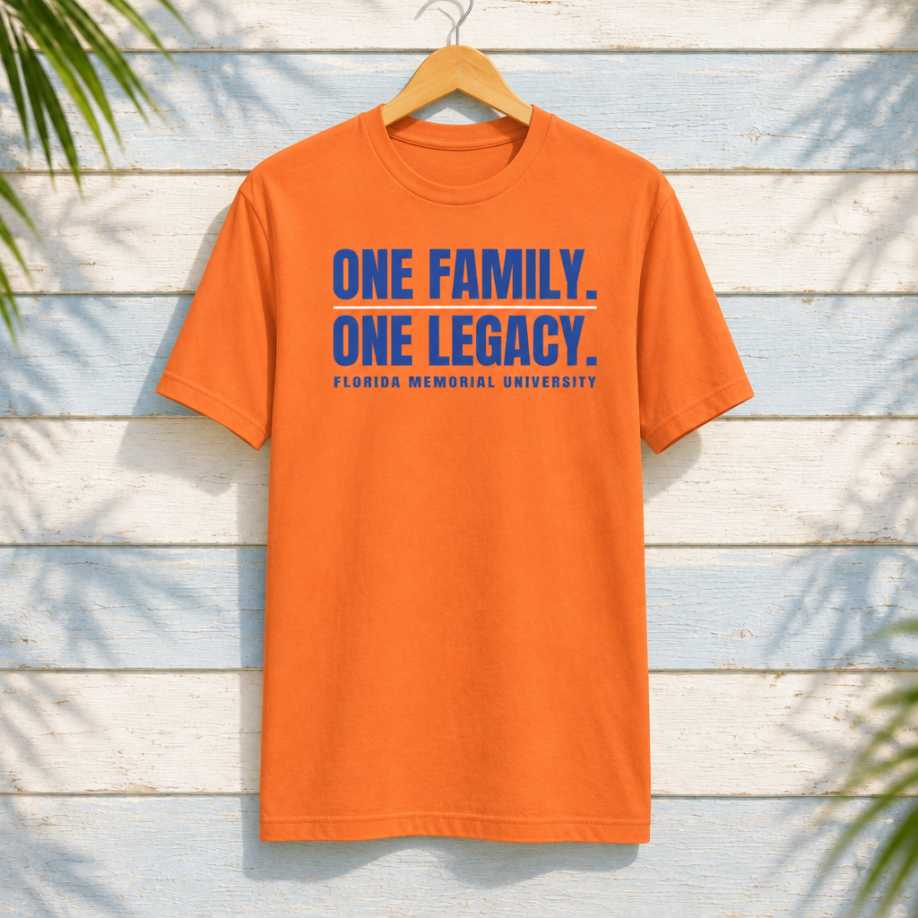 Florida Memorial University One Family. One Legacy. orange T-shirt with blue lettering and white divider, front-facing on a hanger against pale-blue clapboard; creative mockup.