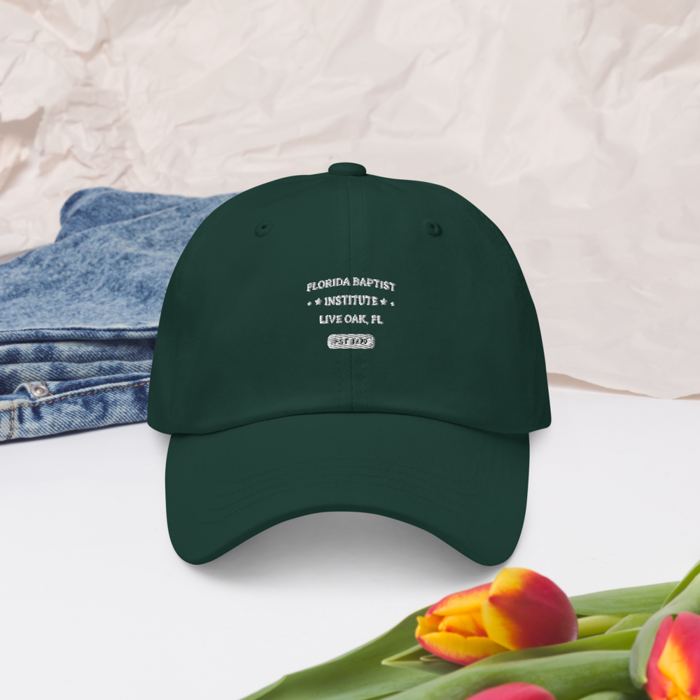Florida Baptist Institute Heritage Dad Hat, front view on spruce