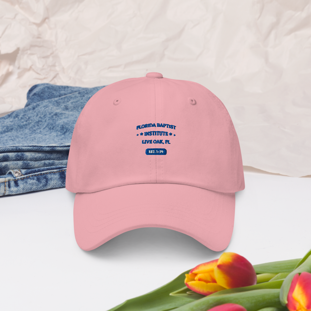 Florida Baptist Institute Heritage Dad Hat, front view on pink