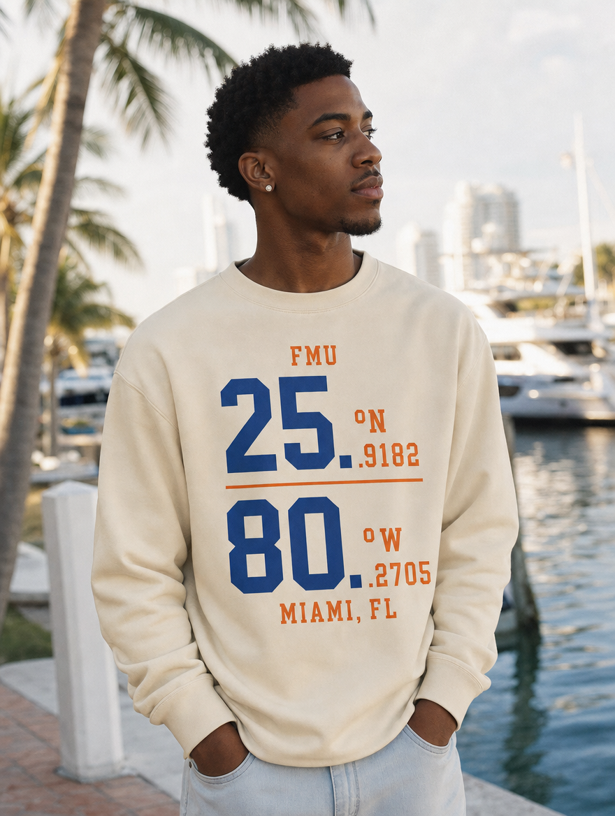 Model in sand FMU Coordinates sweatshirt, royal blue print, Miami marina morning