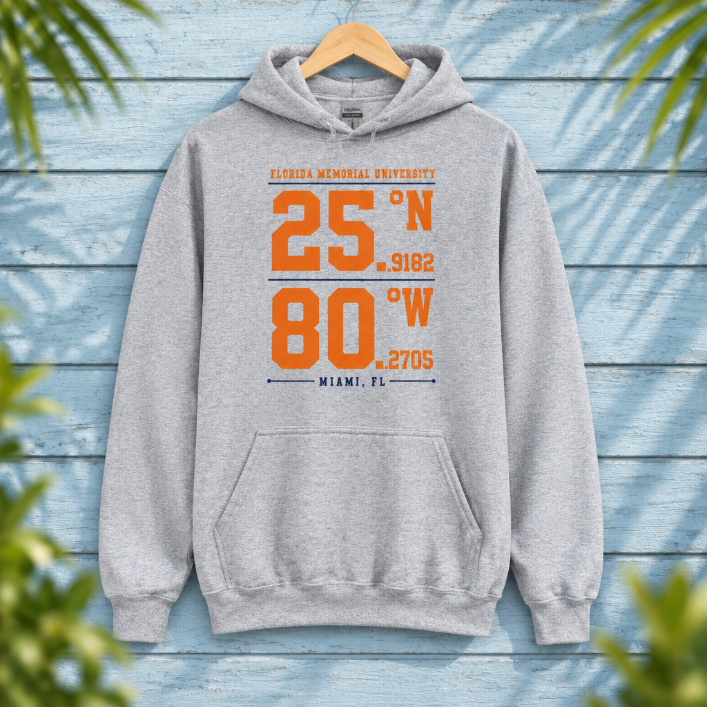 Florida Memorial University Coordinates Sport Grey hoodie with orange and navy campus-coordinate artwork, displayed front-facing on a hanger against pale-blue clapboard; creative mockup.