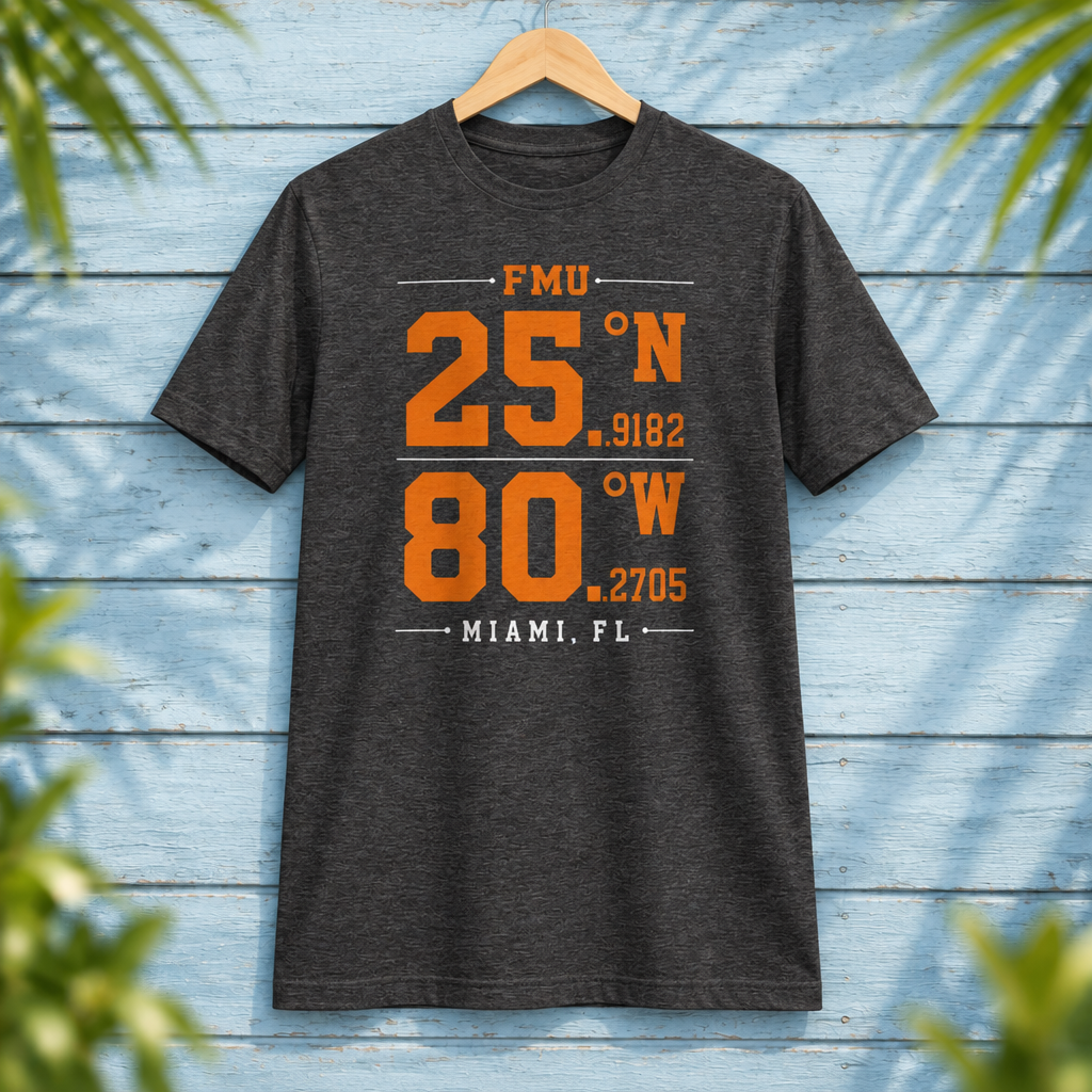 Florida Memorial University Coordinates Dark Grey Heather t-shirt with orange and white campus-coordinate artwork, displayed front-facing on a hanger against pale-blue clapboard; creative mockup.
