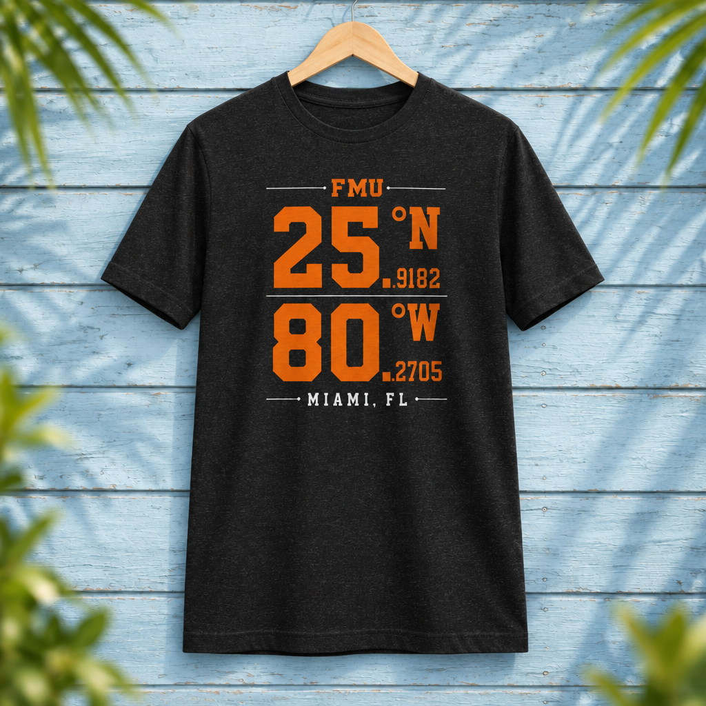 Florida Memorial University Coordinates Black Heather t-shirt with orange and white campus-coordinate artwork, displayed front-facing on a hanger against pale-blue clapboard; creative mockup.