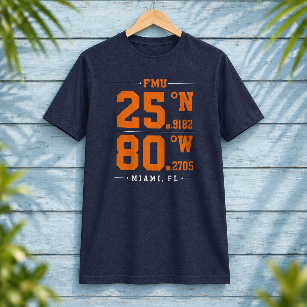Florida Memorial University Coordinates Navy t-shirt with orange and white campus-coordinate artwork, displayed front-facing on a hanger against pale-blue clapboard; creative mockup.